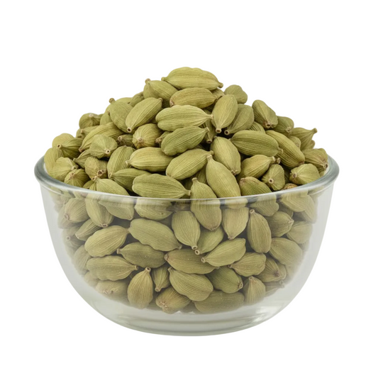 Green cardamom pods filling the original glass bowl