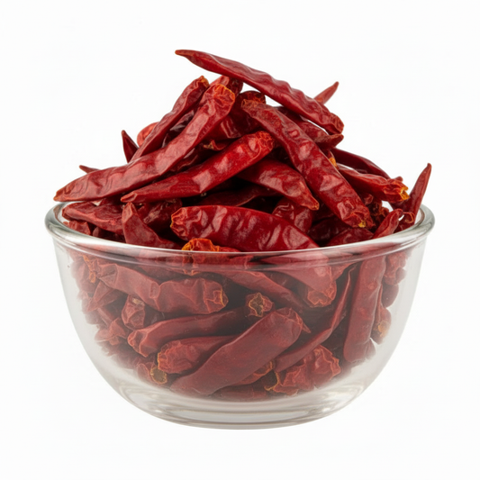 Whole dry spicy chillies in the glass bowl