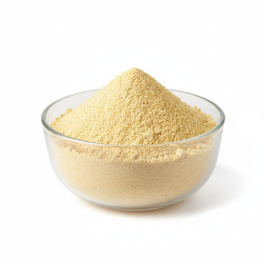 Yellow Jowar flour in a clear glass bowl